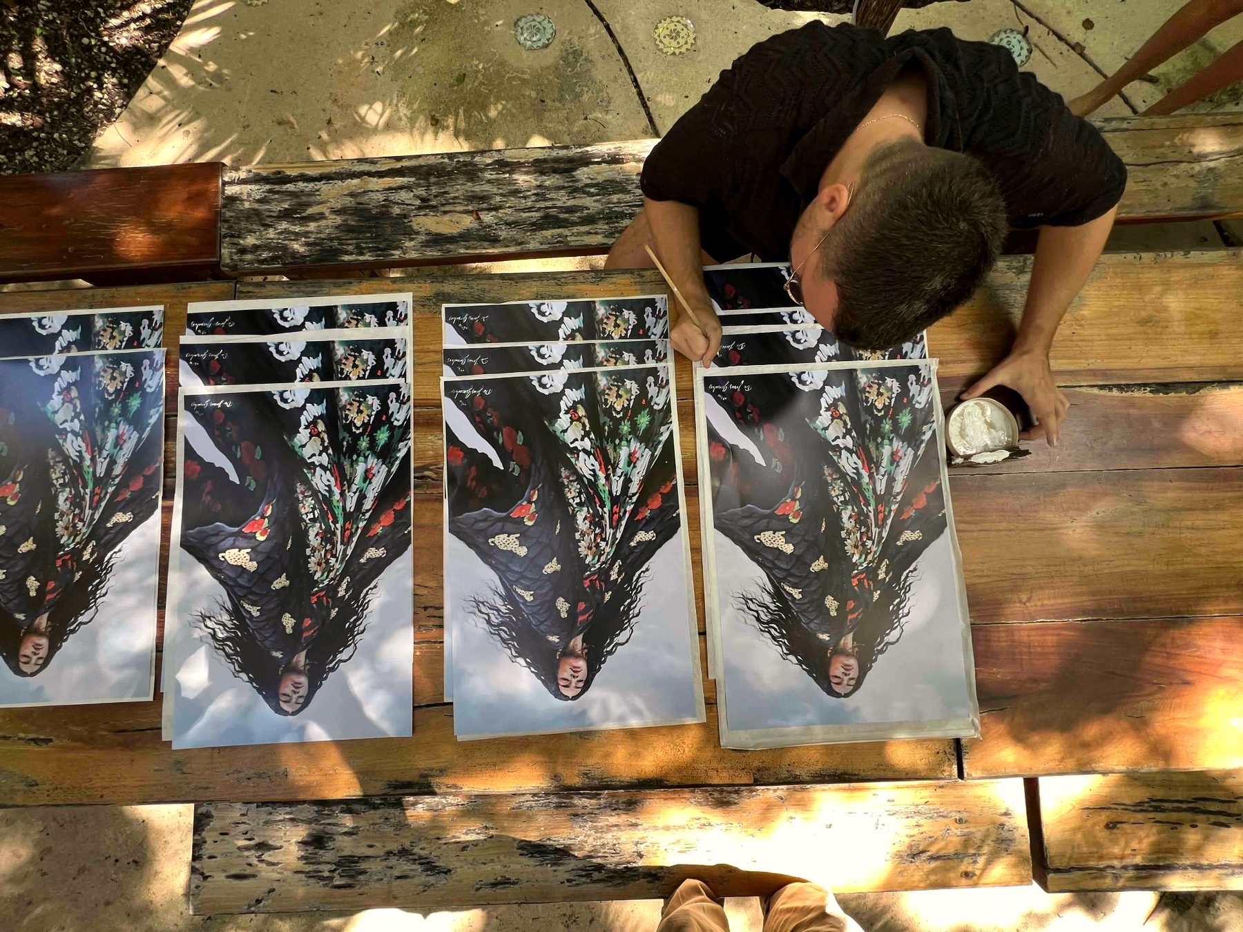 Artist signing prints — editions in process