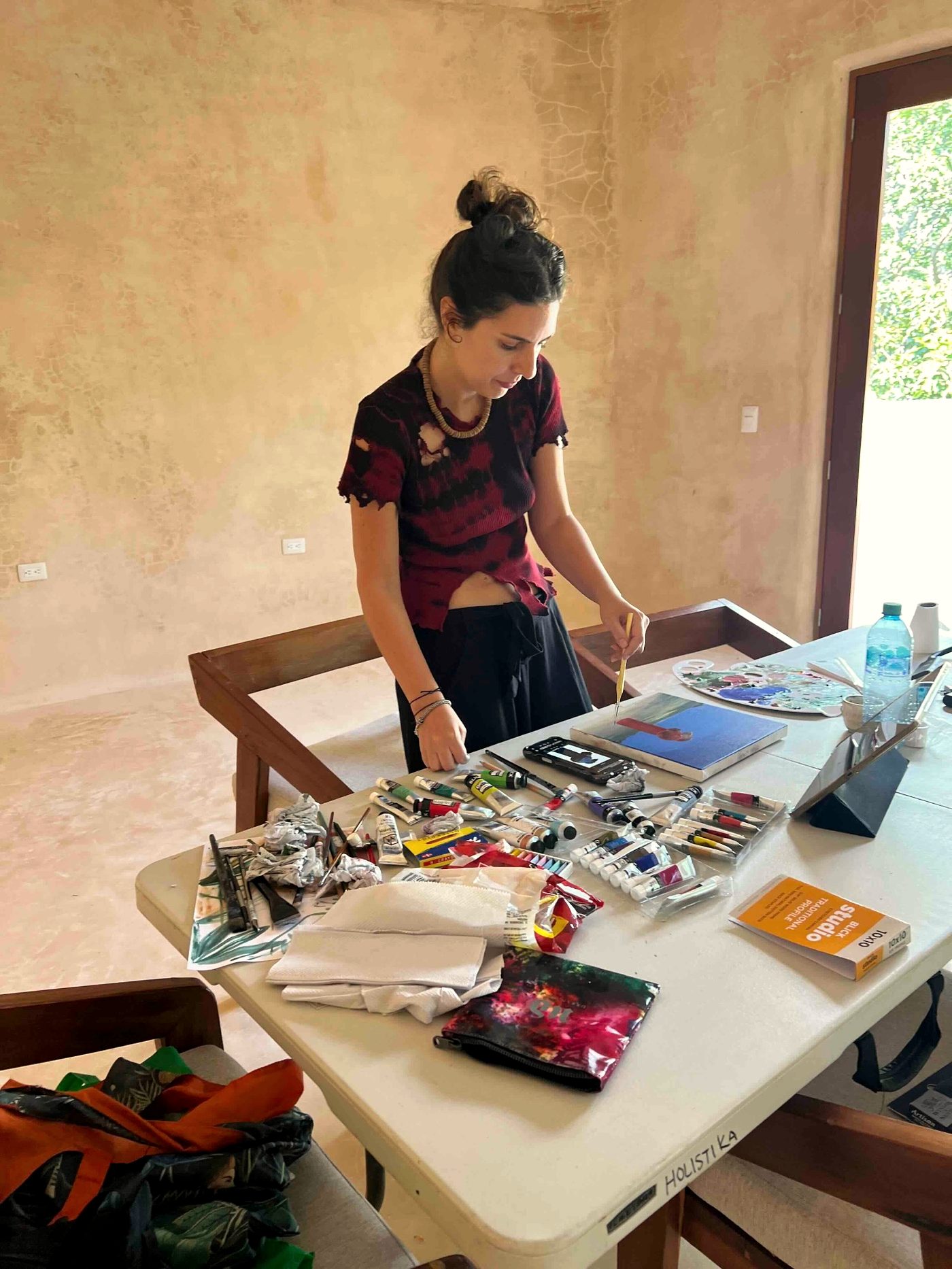 Artist working in TAC studio, Tulum